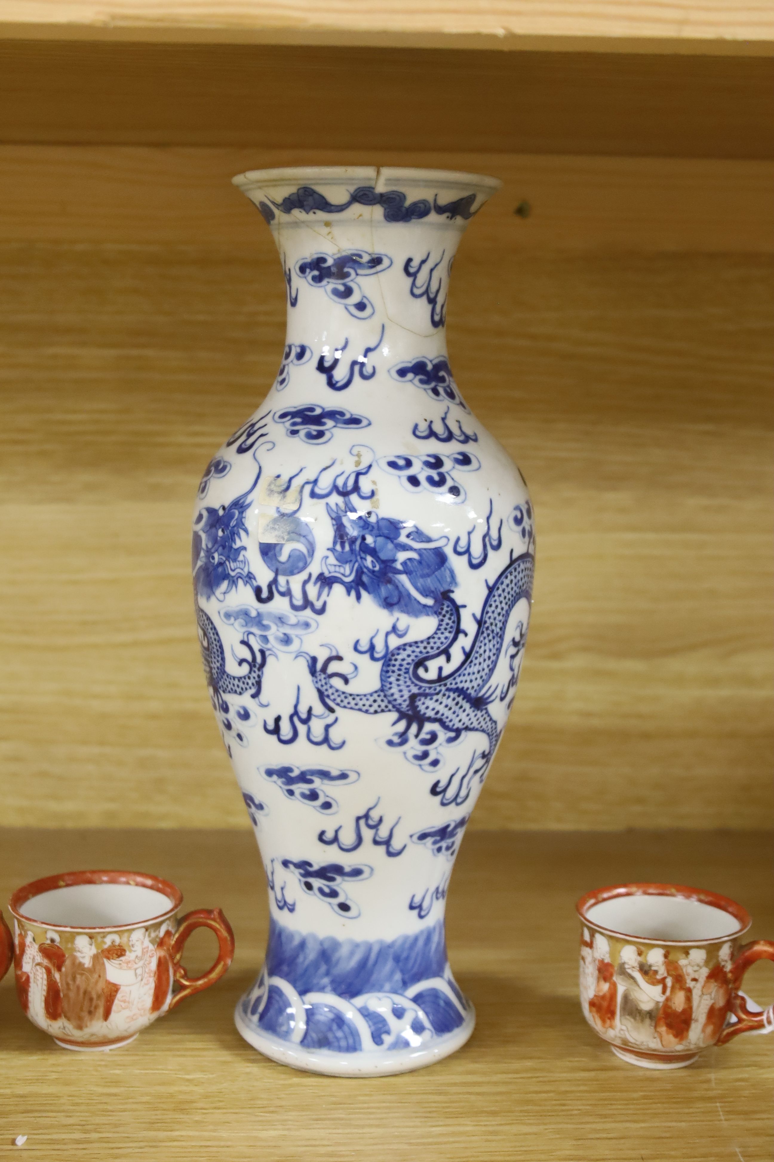 A Chinese blue and white dragon vase, a celadon glazed dish, a blue and white tea bowl and saucer and Kutani wares